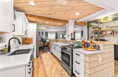 Bay Point Casa | Dog-friendly waterfront home with outdoor kitchen, bar, firepit, & kayak launch