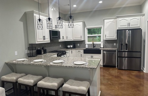 Titus Casa | Dogwood Cottage at Lake Jordan with boat dock/hot tub lakeside/RV parking spot