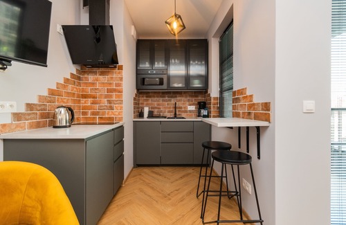 Mlyniska Apartamento | Doki Studio Montownia byGrand Apartments