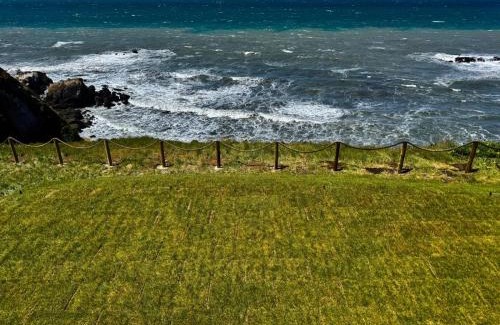 Shelter Cove Apartamento | Dolphin by OceanviewHotTubs Oceanfront Shelter Cove Tesla