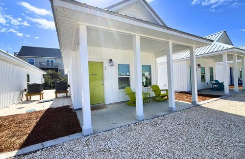 Port St. Joe Cabaña | "Dolphin Cottage" is a pet friendly, 2 bed, 1 1/2 bath unit accepting 5 guests. Community Pool.