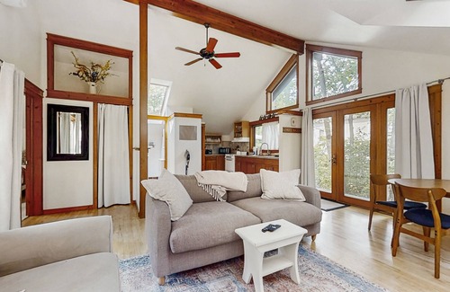 Glen Arbor Cabaña | Downtown cottage with nearby beach access, a grill, deck, & washer/dryer