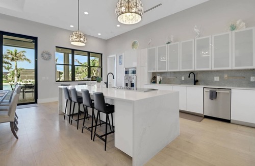 Pelican Casa | Dream Home Vacation! Stunning Waterfront! Luxurious Resort-Style Lagoon Pool, Spa & Outdoor Living!