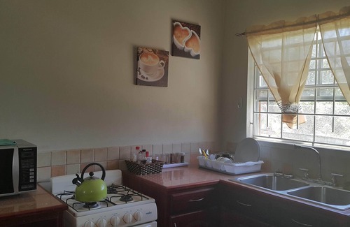 Anse La Raye Apartamento | The Travellers Haven - Vacaciones tranquilas y confortables