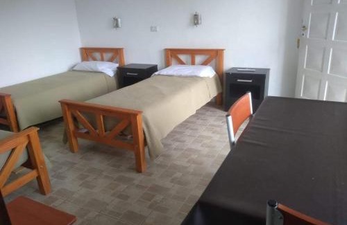 Comandante Luis Piedrabuena Apartamento | El Mastil Departamentos Dormis Habitaciones
