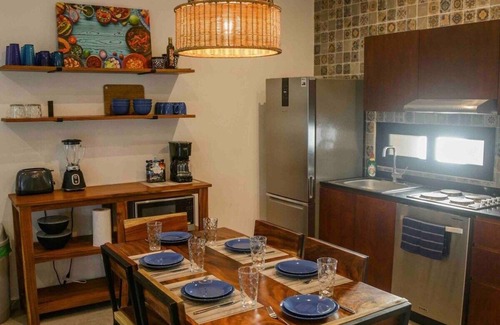 Mario Villanueva Madrid Condominio | Elegant 2-Bedroom 2-Bath Retreat with Rooftop Oasis & Pool