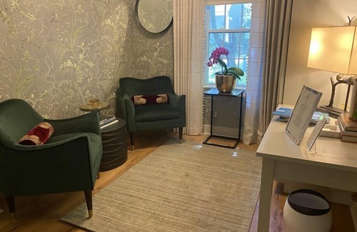 Lenox Cama Y Desayuno | Elegant Carriage House room with a queen bed and private patio.