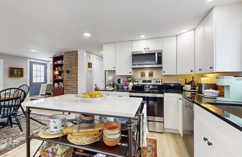 Wiscasset Casa | Elegant home with a cozy living area, Wifi, backyard, and washer/dryer
