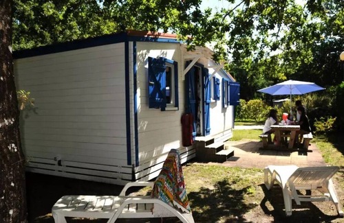 Biscarrosse Chalet De Esquí | En Chon Les Pins - Camping-Caravaning *** - Chalet wood 30m2 2 bedrooms n° 63 SATURDAY / SATURDAY 4 to 5 people - 4 pers. included in the tariff