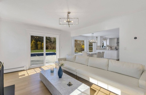 Southold Casa | Enchanting home with large backyard, stunning pool, expansive patio, and...