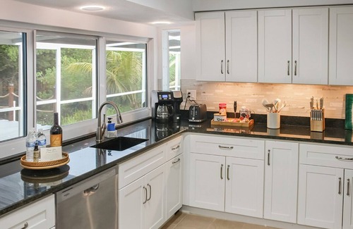 Fort Myers Casa | Enjoy a stunning waterfront view, pool table,kayaks, fishing, BBQ, heated & pool