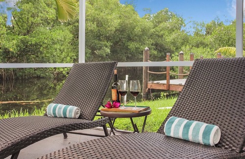 Fort Myers Casa | Enjoy a stunning waterfront view, pool table,kayaks, fishing, BBQ, heated & pool