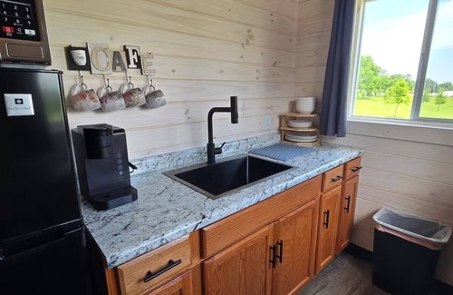 Tuscumbia Cabina | Enjoy cabin #64 at Heritage Acres Park with swimming, splash pad & more!