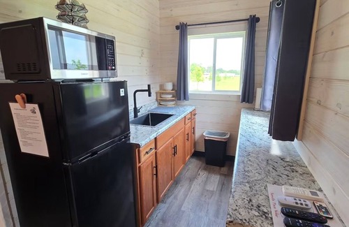 Tuscumbia Cabina | Enjoy cabin #64 at Heritage Acres Park with swimming, splash pad & more!