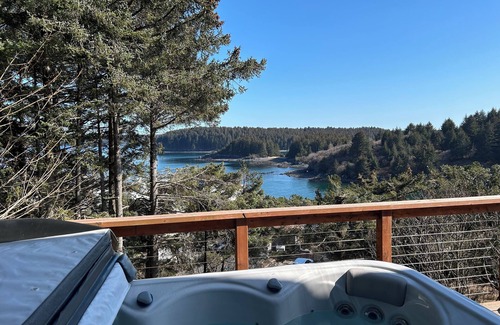 Kodiak Casa | Enjoy channel views from the hot tub. Minutes walk from downtown and waterfront.