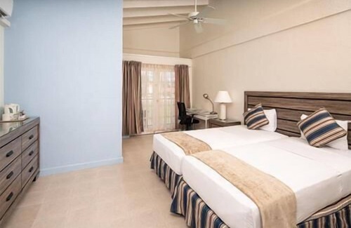 St. Lawrence Gap Hotel | Enjoy Great Games and Events at Garrison Savannah! FREE Parking, Outdoor Pool!
