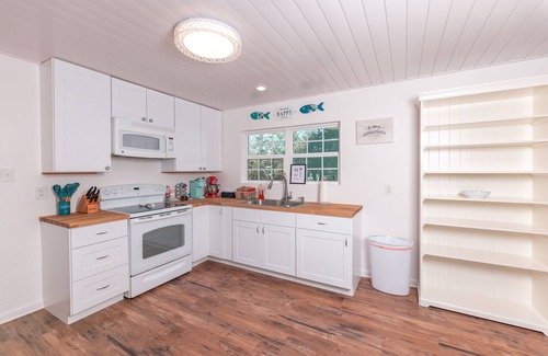 Sunrise Beach Village Cabaña | Enjoy our speakeasy at our 2 bedroom cottage!