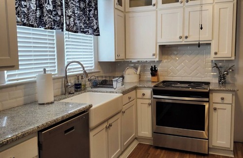 Mount Airy Casa | Enjoy small-town, Main Street from the front porch of this historic bungalow!