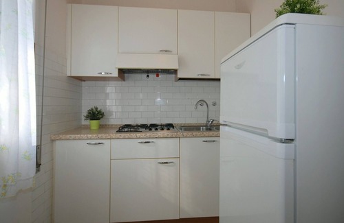 Lignano Pineta Villa | Disfruta del jardín de nuestro acogedor piso.