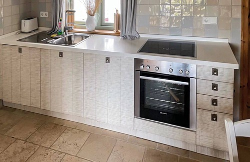 Fehmarnsund Apartamento | Enjoy your vacation: Sea view, terrace & fireplace -BEACHHOUSE FEHMARN apartment Ostwind