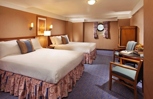 Harbor Hotel | Escape to a Classic Stateroom on an Iconic Ocean Liner with Dining | 3 Rooms