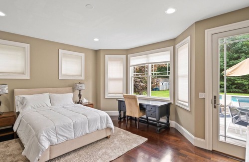 Wainscott Woods Casa | Exceptional shingle-style home sited on just under an acre of land,...
