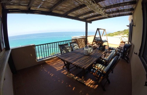 Alghero Apartamento | Exclusivo ático con vistas al mar ....... con playa desierta debajo de la casa.