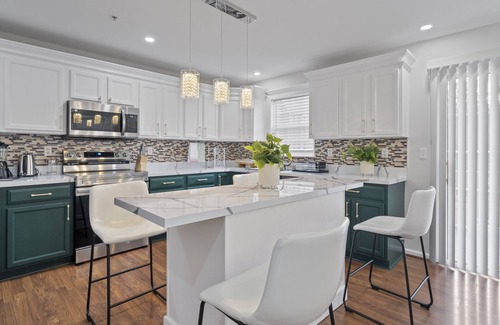 Owings Mills Casa | Experience Elevated Comfort: Luxe Breeze Townhouse.
