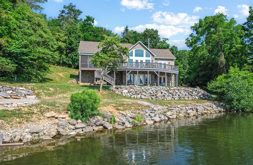 Pulaski Casa | Experience the perfect blend of rustic charm and modern luxury in this Claytor lakefront retreat
