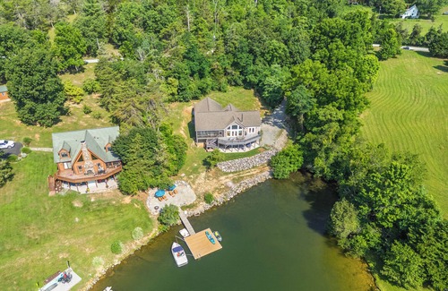 Pulaski Casa | Experience the perfect blend of rustic charm and modern luxury in this Claytor lakefront retreat