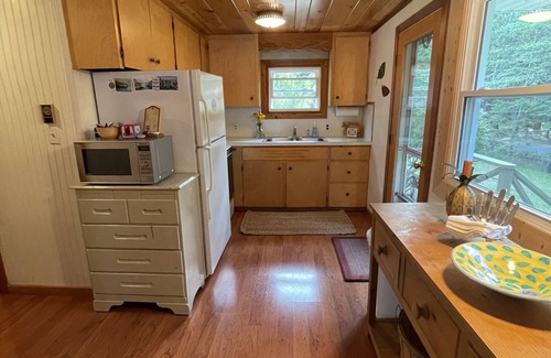 Lake Leelanau Cabaña | Fall 2025 open, stunning, cozy, sunset waterfront on N Lake Leelanau.
