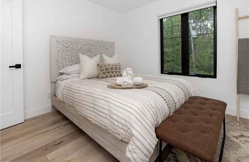 Kemble Casa | Farmhouse chic on Georgian Bluffs, where luxury meets comfort.