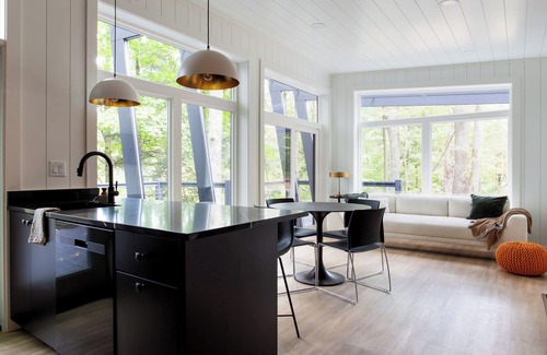 Loudonville Cabina | Fauna Bluff, A cliffside 2-bedroom modern cottage overlooking a bubbling stream.