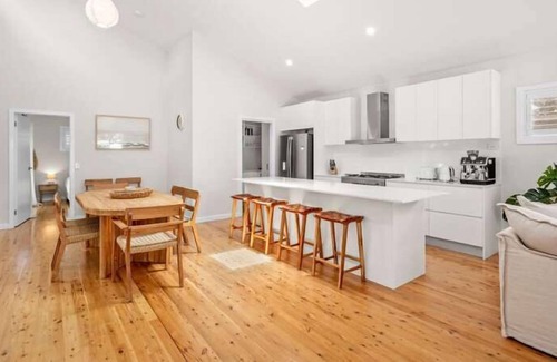 Bateau Bay Casa | Featuring a stunning open-plan living and dining area, this sunny, light-filled, well-appointed, ful