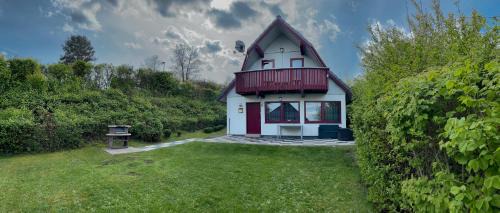 Seepark Kirchheim Casa | Ferienhaus "Gestiefelter Kater" am See im Bergland