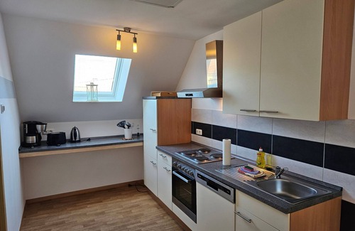 Neppermin Apartamento | Ferienpark Neppermin Ferienhaus Inselblick - Ferienwohnung Inselblick im Obergeschoss