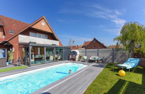 Bensersiel Apartamento | Ferienwohnung Haus zum Seehund mit Pool und Frühstücksoption