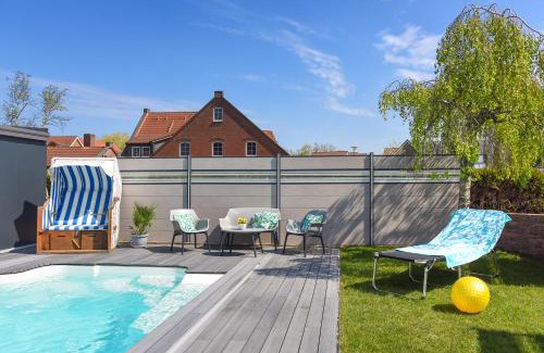 Bensersiel Apartamento | Ferienwohnung Haus zum Seehund mit Pool und Frühstücksoption
