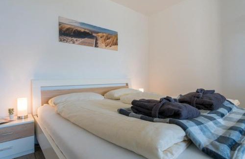 Heiligenhafen Apartamento | Ferienwohnung Sandküste mit Strandkorb & Indoor Spielplatz