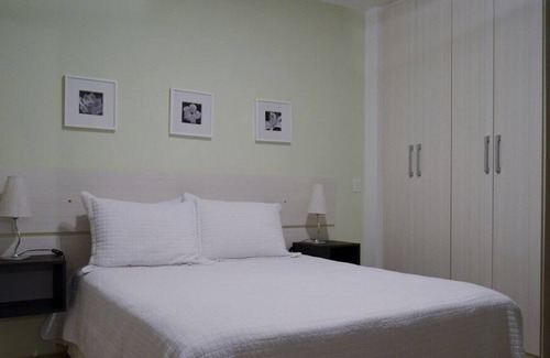 Boqueirao Apartamento | Piso 1 cama Boqueirão de 43m2 - frente al mar con garaje, aire acondicionado y servicios