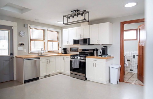 Midway Casa | Follow the Yellow Front Door to a welcoming home close to everything.