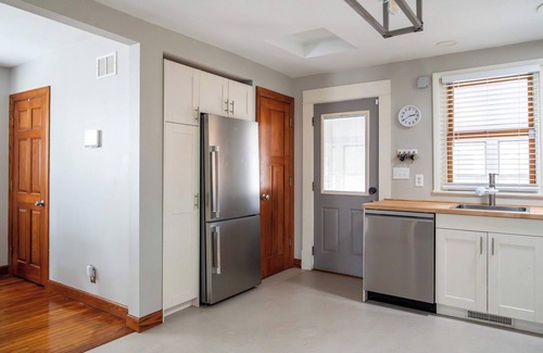 Midway Casa | Follow the Yellow Front Door to a welcoming home close to everything.