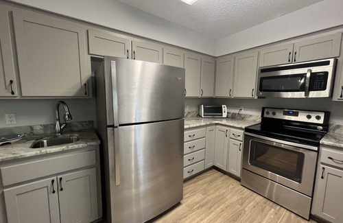 Mount Ida Condominio | Forest view, log-sided two bedroom, two bath condo on Lake Ouachita. by RedAwning