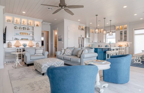 Spanish Grant Casa | From the moment you arrive, the Gulf stretches out before you in an endless sweep of blue and gold — a living canvas of rolling waves, soft breezes, and skies that shift with every hour. Here, the ocean isn’t just a view; it’s a rhythm that slows you