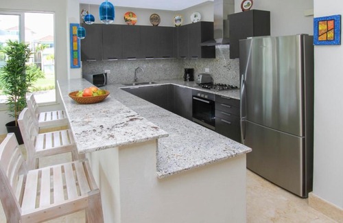 Punta Cana Apartamento | Fully equipped apartment overlooking golf course at luxury beach resort