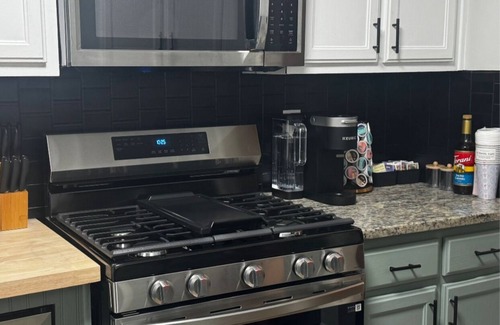 Church Street Casa | Fully Furnished Modern Home Patio with BBQ Grill for Relaxed Outdoor Living