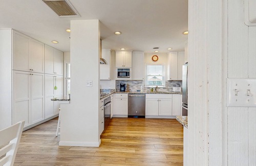 Avon Casa | Fun beachfront home w/shared pool, WiFi, private washer & dryer, central AC