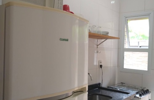 Caraguatatuba Apartamento | Cocina con piscina, patio, barbacoa, cerca de Playa Martim de Sá-