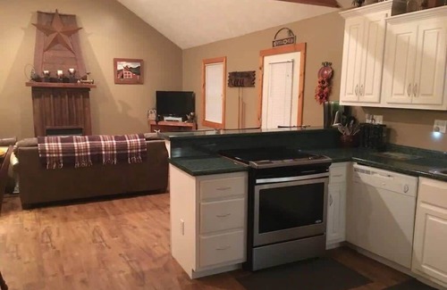 Spencer Cabina | Gas fireplace, firepit, and cedar Adirondack chair