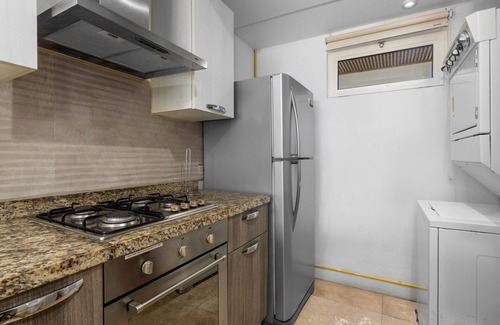 Boegoeroei Condominio | Gated community with resort-style amenities - 2 bedroom, 2 bath with an open concept living room and kitchen. Private balcony overlooks pool area.
